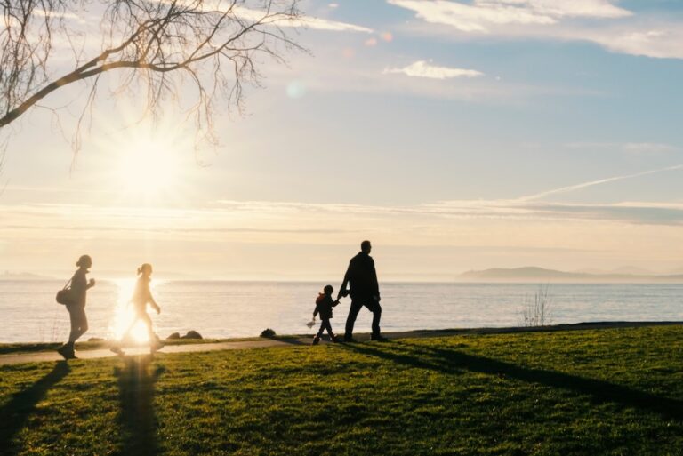 parents-walking-with-children-along-the-shore-late-2023-11-27-05-23-54-utc